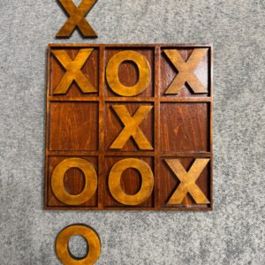 Dark wooden tic tac toe board with removable golden-brown X and O playing pieces