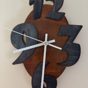 Brown wooden wall clock with oversized black numbers and white clock hands