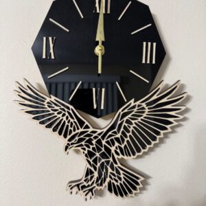 Eagle in flight wood and black acrylic wall clock with Roman numerals and gold-tone hands