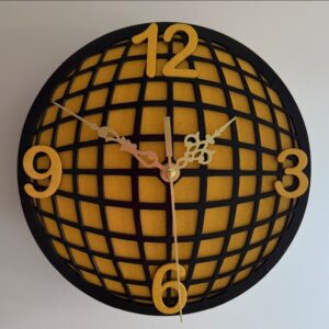 Round black and gold wall clock with curved grid pattern, raised gold numbers and ornate clock hands